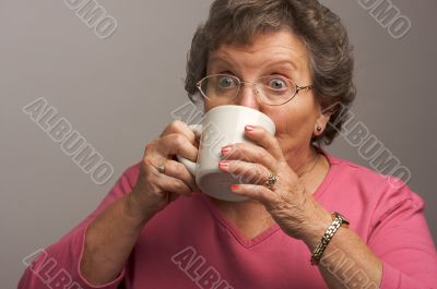 Senior Woman Enjoys Her Coffee