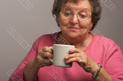 Senior Woman Enjoys Her Coffee