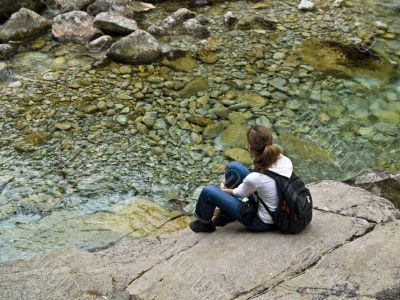 Young girl on the stone