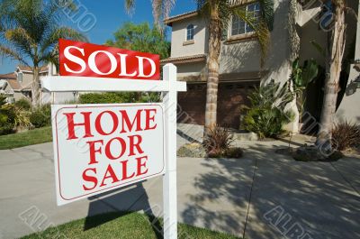 Sold Home For Sale Sign & New House