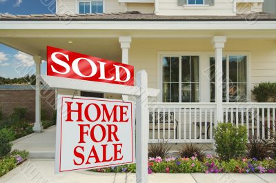 Sold Home For Sale Sign & New House