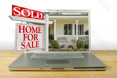 Sold Home For Sale Sign on Laptop