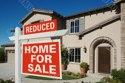 Reduced Home For Sale Sign & New House