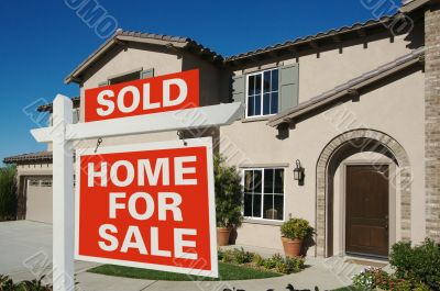 Sold Home For Sale Sign & New House