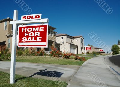 Sold Home For Sale Sign & New House