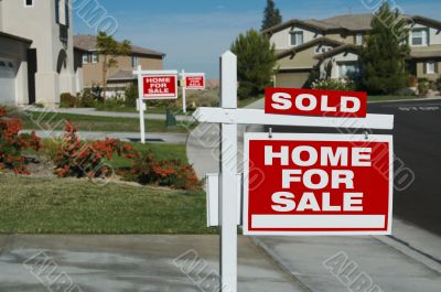 Sold Home For Sale Sign & New House