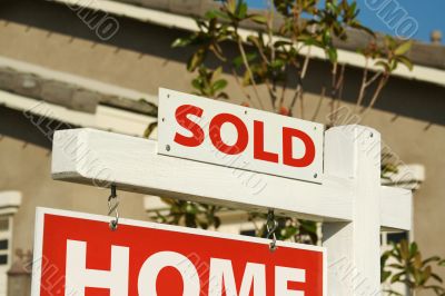 Sold Home For Sale Sign & New House