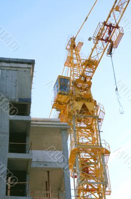 New building under construction with crane