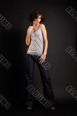 brunette girl posing on dark background