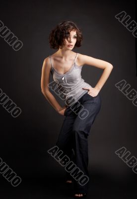 brunette girl posing on dark background
