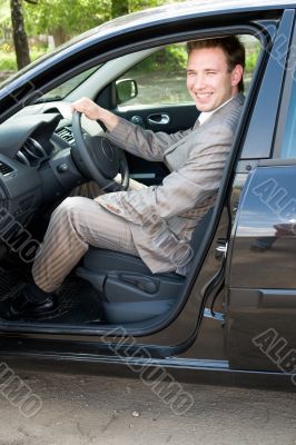businessman at the wheel