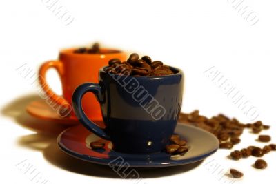 espresso cups filled with coffee beans