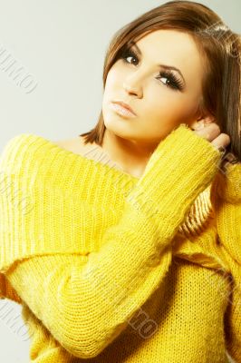 Beautiful woman in yellow sweater