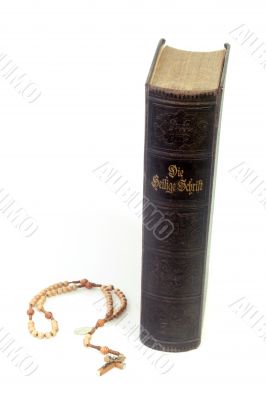 Holy bible with rosary