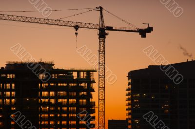 Silhouette of Crane and Building