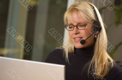 Attractive Businesswoman with Phone Headset