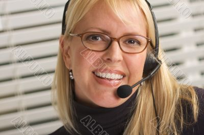 Attractive Businesswoman with Phone Headset