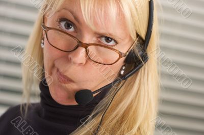 Attractive Businesswoman with Phone Headset