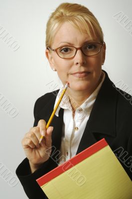Beautiful Woman Thinks with Pencil & Notepad
