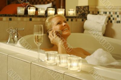Woman in Bath Using Cell Phone