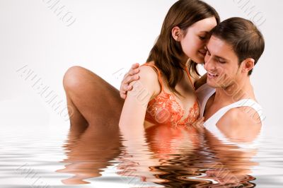 Sweet young couple enjoying the water