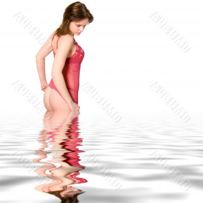 white woman in red lingery standing in a pool
