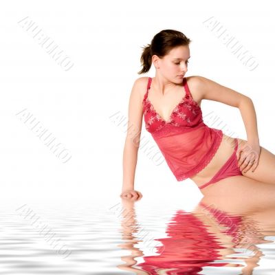 Woman in red lingerie sitting relaxing by the pool