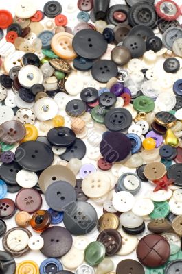 Sew colored button on white