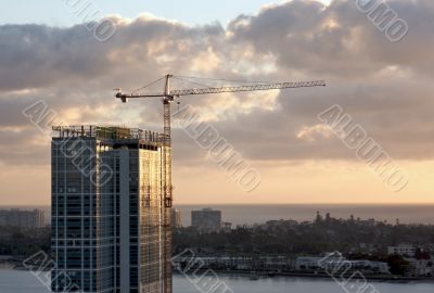 Silhouette of Crane and Building