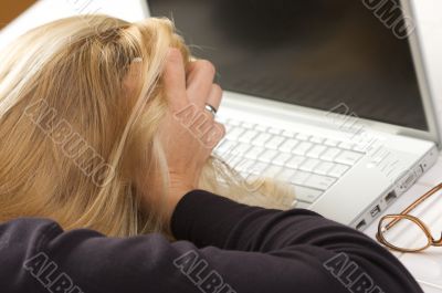 Frustrated Female Using Laptop