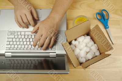 Businessman Works on Laptop