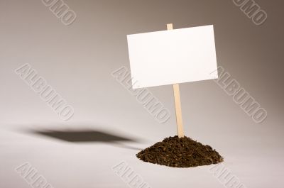 Blank White Sign in Dirt Pile