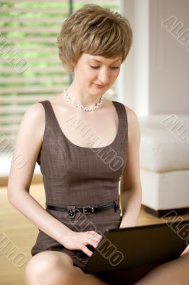 young woman working on a laptop