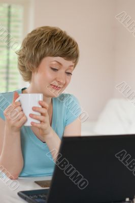 young woman working on a laptop