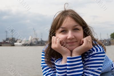 Beauty girl in sailor`s striped vest