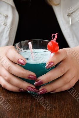 The wine glass in female hands