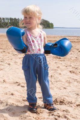 toddler in boxing gloves