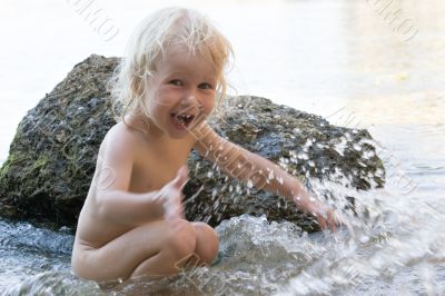 child in waves