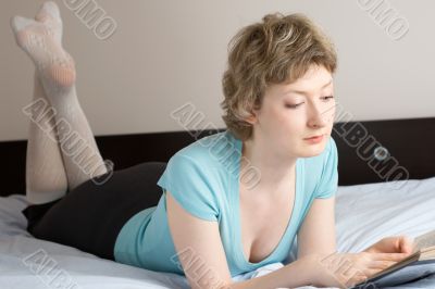 young woman reading a book