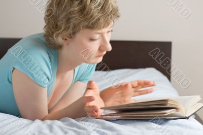young woman reading a book