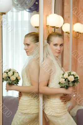 The bride near a mirror