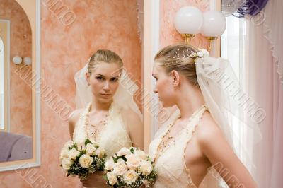 The bride near a mirror