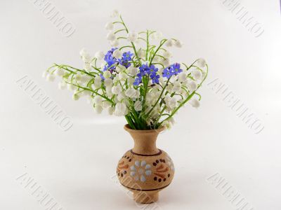 Lily of the valleies in the clay vase
