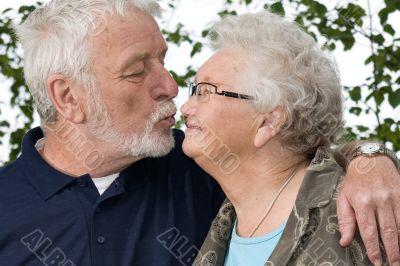 Grandparents kissing