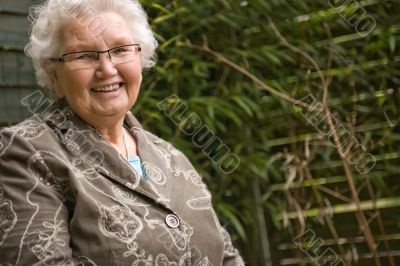 Grey woman sitting relaxed