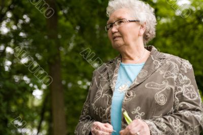grandmother standing outside looking