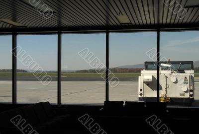 airplane tow truck through a window