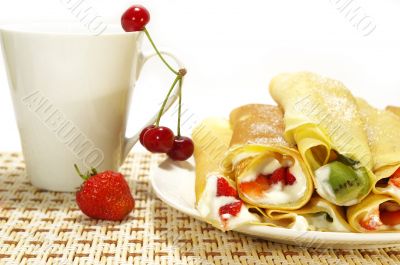 Pancakes filled, berries and cup