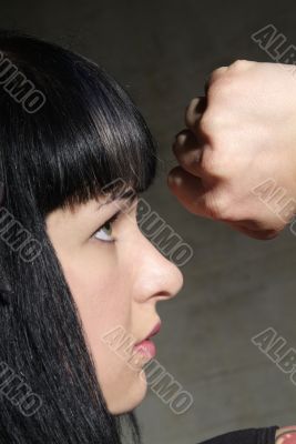 woman clenches fist