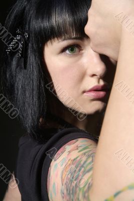woman with tattoo and fist